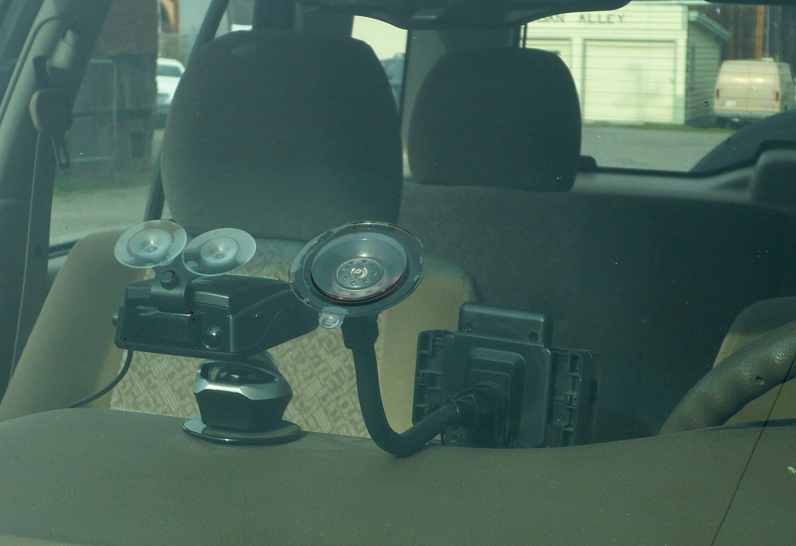 A dashcam mounted on a windscreen, seen from inside the car